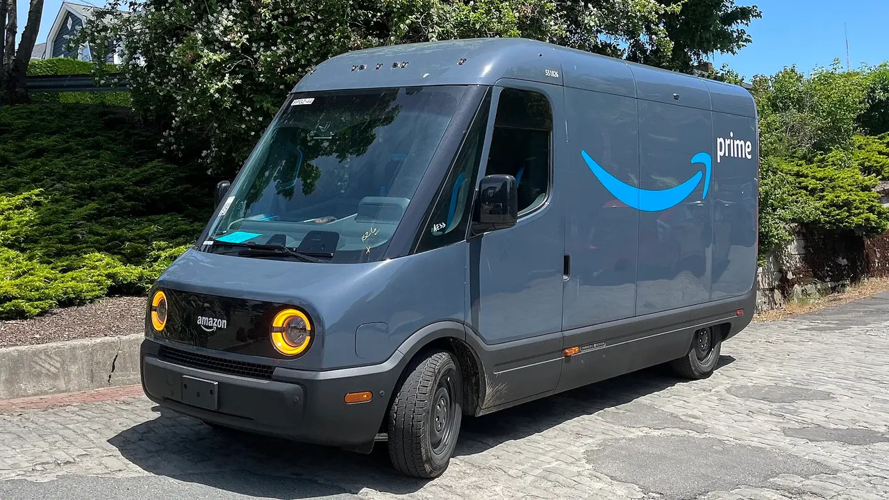 The front of a Rivian electric delivery van operated by Amazon